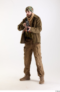 Andrew Elliott Insurgent Pose with Gun holding gun standing whole…